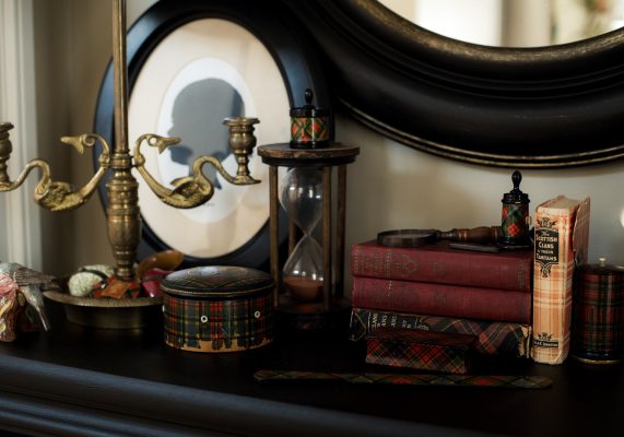 Organized table with books and other decor