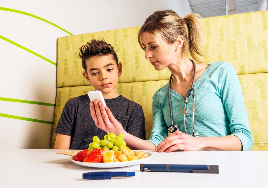 doctor meeting with diabetic boy