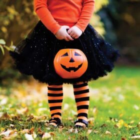 girl with pumpkin bucket