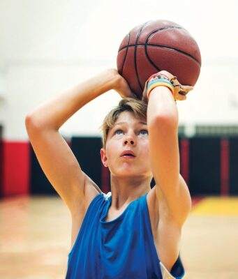 boy playing basketball