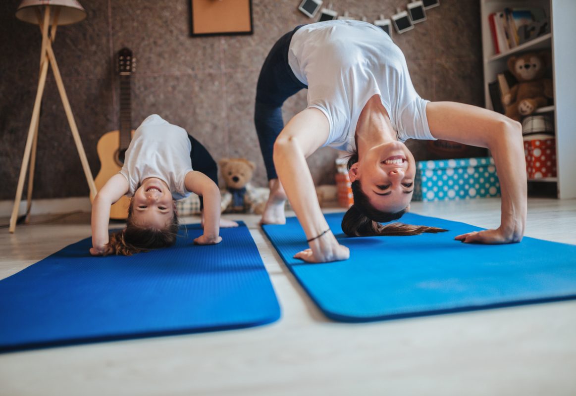 Mother and daughter working out together