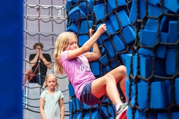 girl climbing ropes at Wintergreen