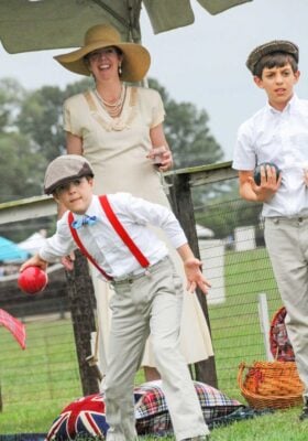 A mother and her two sons playing tailgate games at Foxfield Family Day