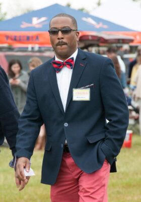 Stylish man at Foxfield Races wearing bow tie suit