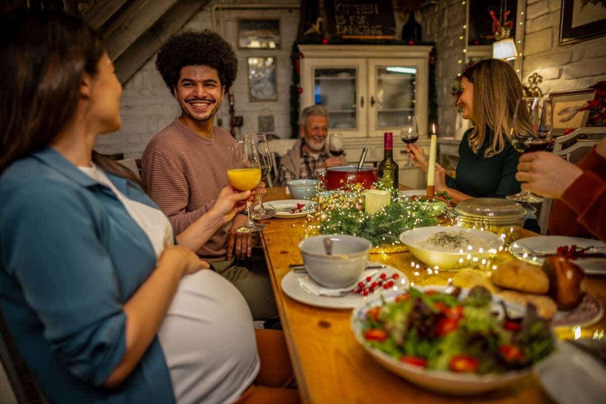 Pregnant mom at holiday dinner, winter vaccinations