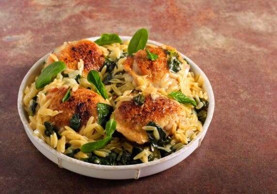 Lemon chicken orzo served in a bowl