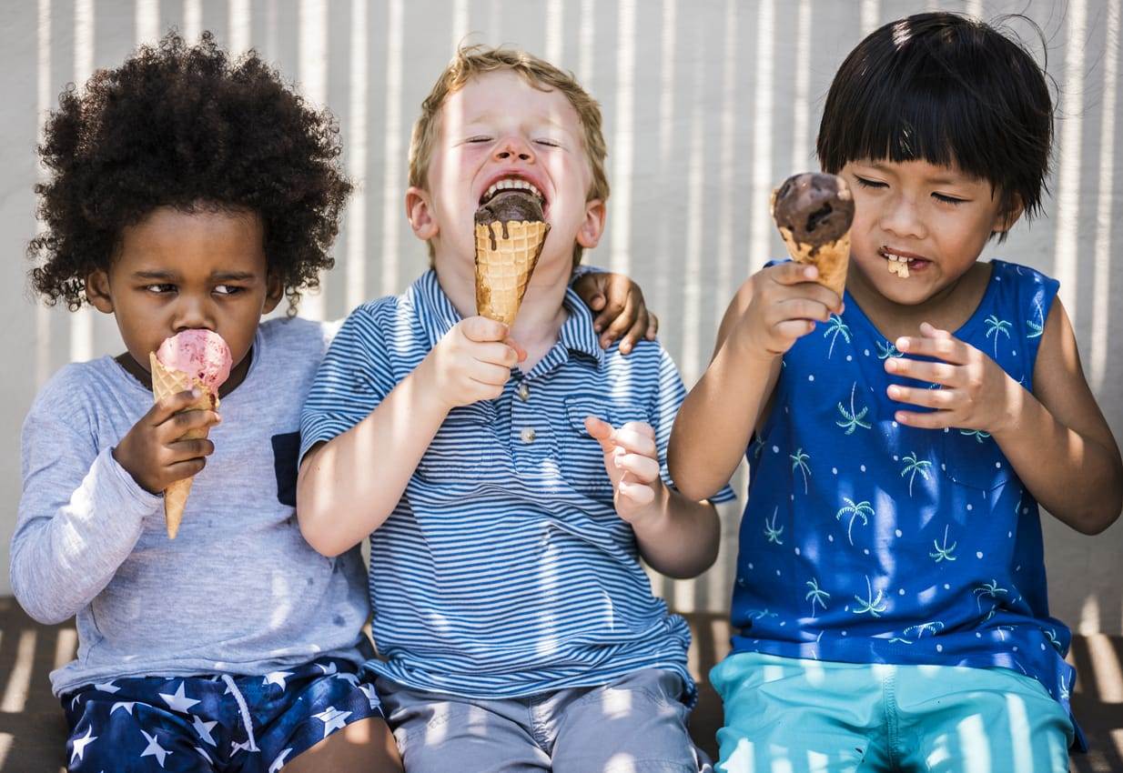 three preschoolers enjoying ice cream cones near Charlottesville virginia