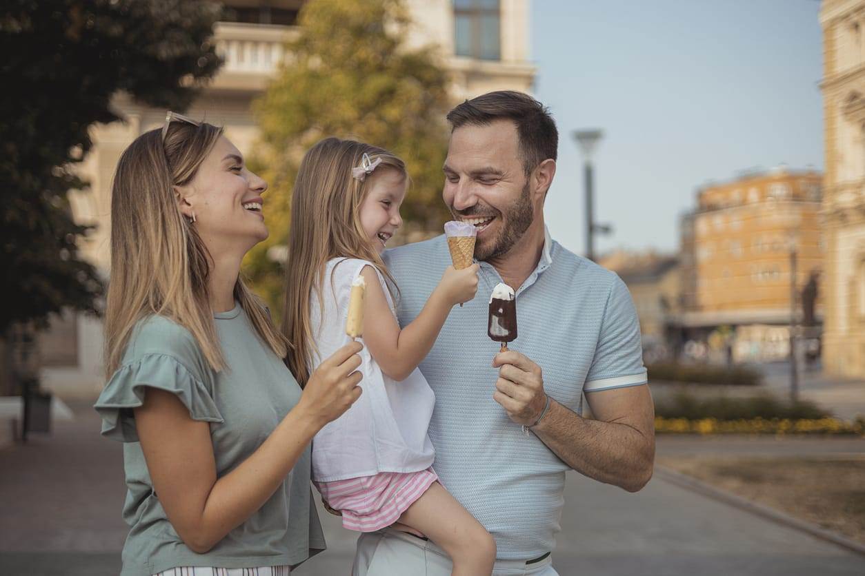 Family eating ice cream bar and ice cream cone in Charlottesville
