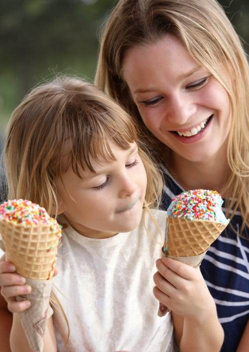 mother and daughter eating ice cream cones with sprinkles in charlottesville