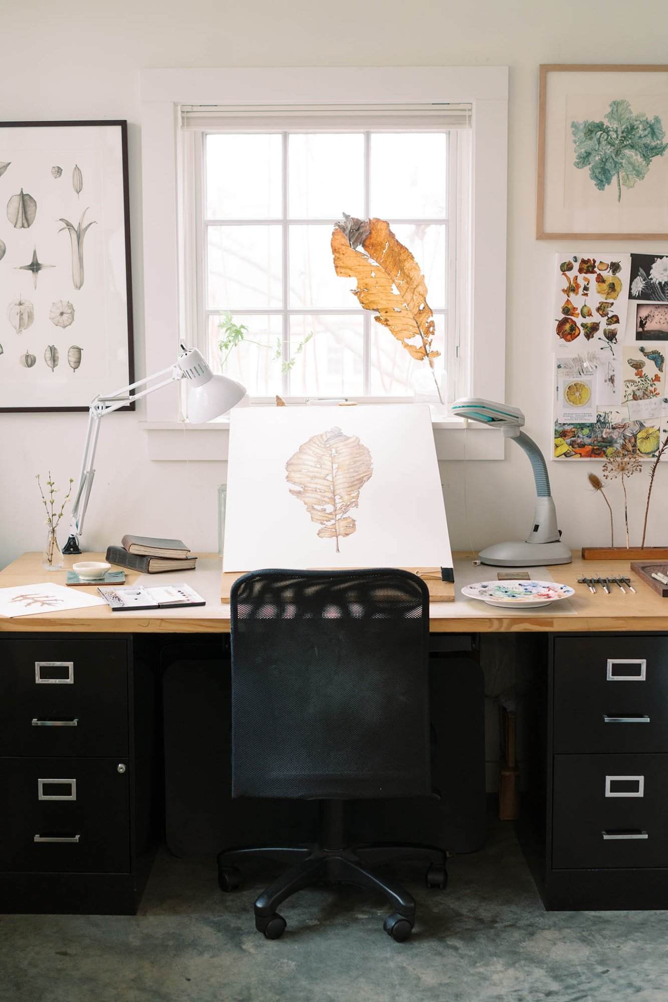 Lara Call Gastinger art studio with leaf and illustration in progress