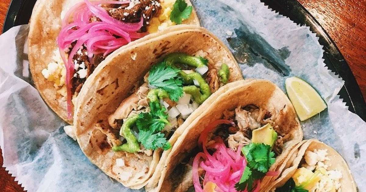 Plate of colorful tacos at Brazos Tacos