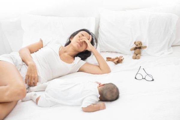 frustrated and tired mom with baby