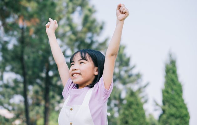 Portrait of Asian little girl playing in the park