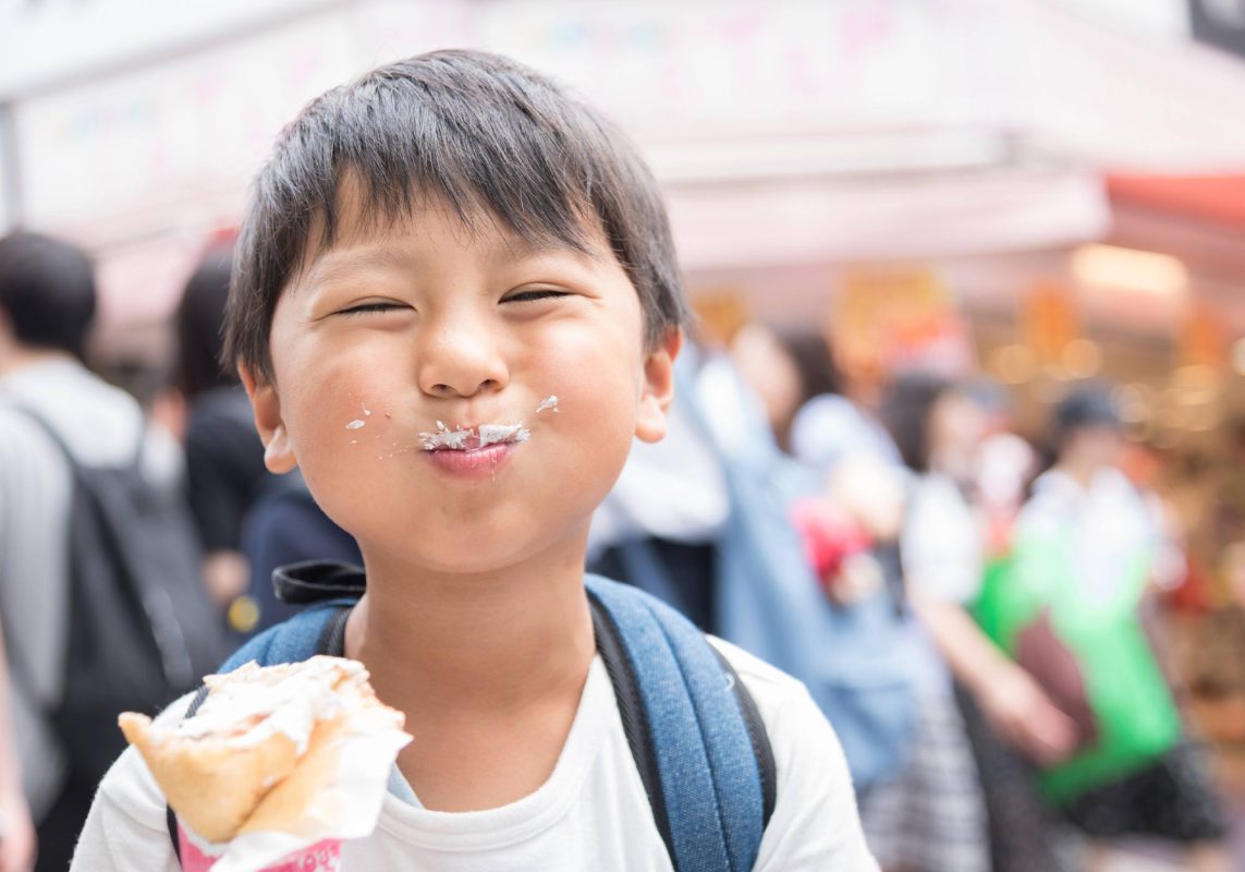 Boy enjoying crepe at a Virginia fair